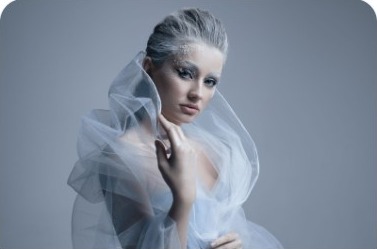 Fashion model in a flowing white gown